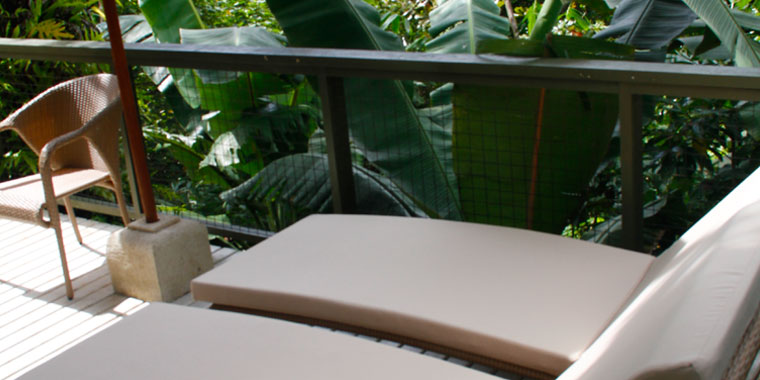 Lounge chairs on Bayside Palau B&B balcony on the outer fringe of Nikko Bay